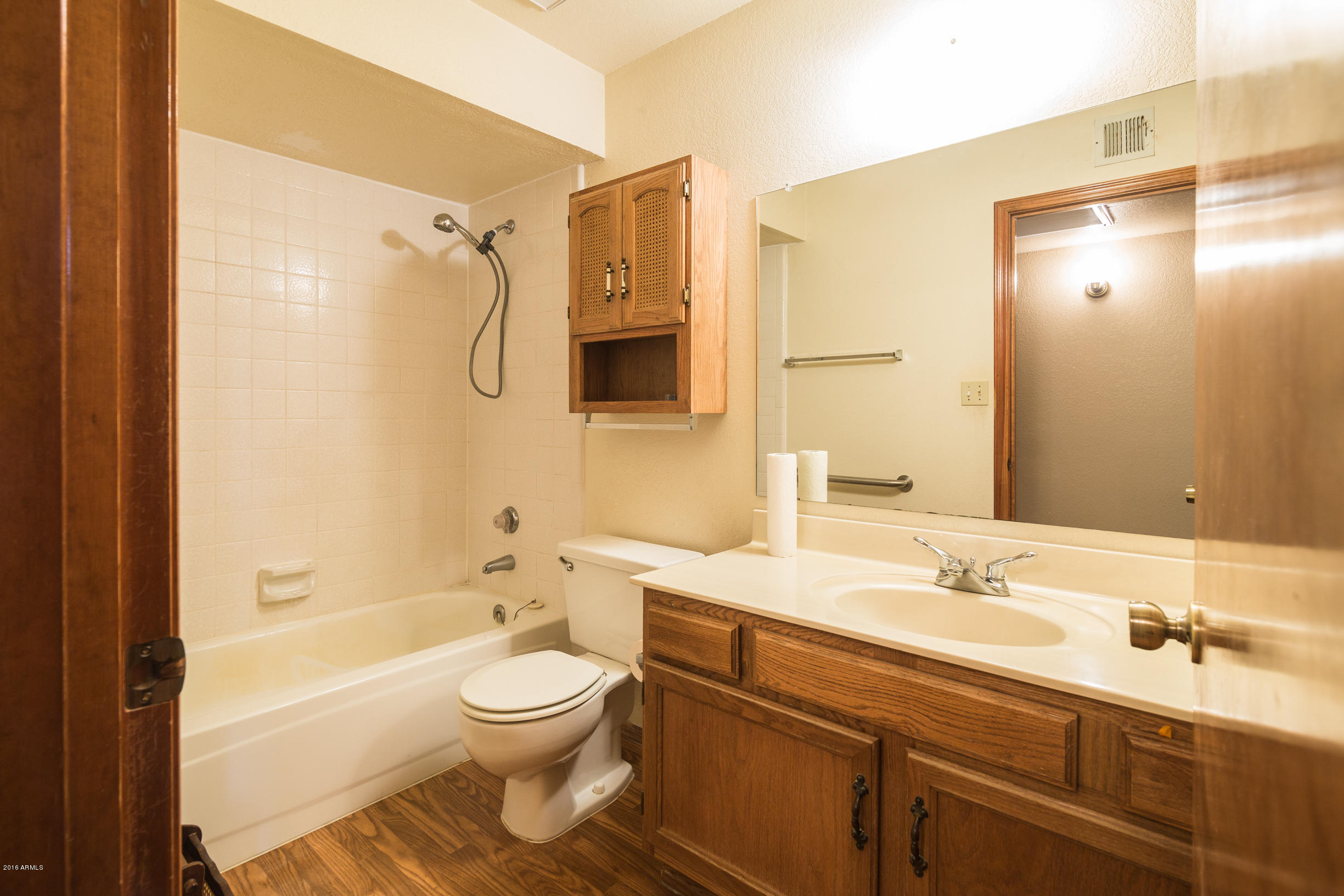 542 South Higley Road, Unit 78 Mesa, AZ 85206 - Photo 14 of 17 a bathroom with a granite countertop sink toilet and shower