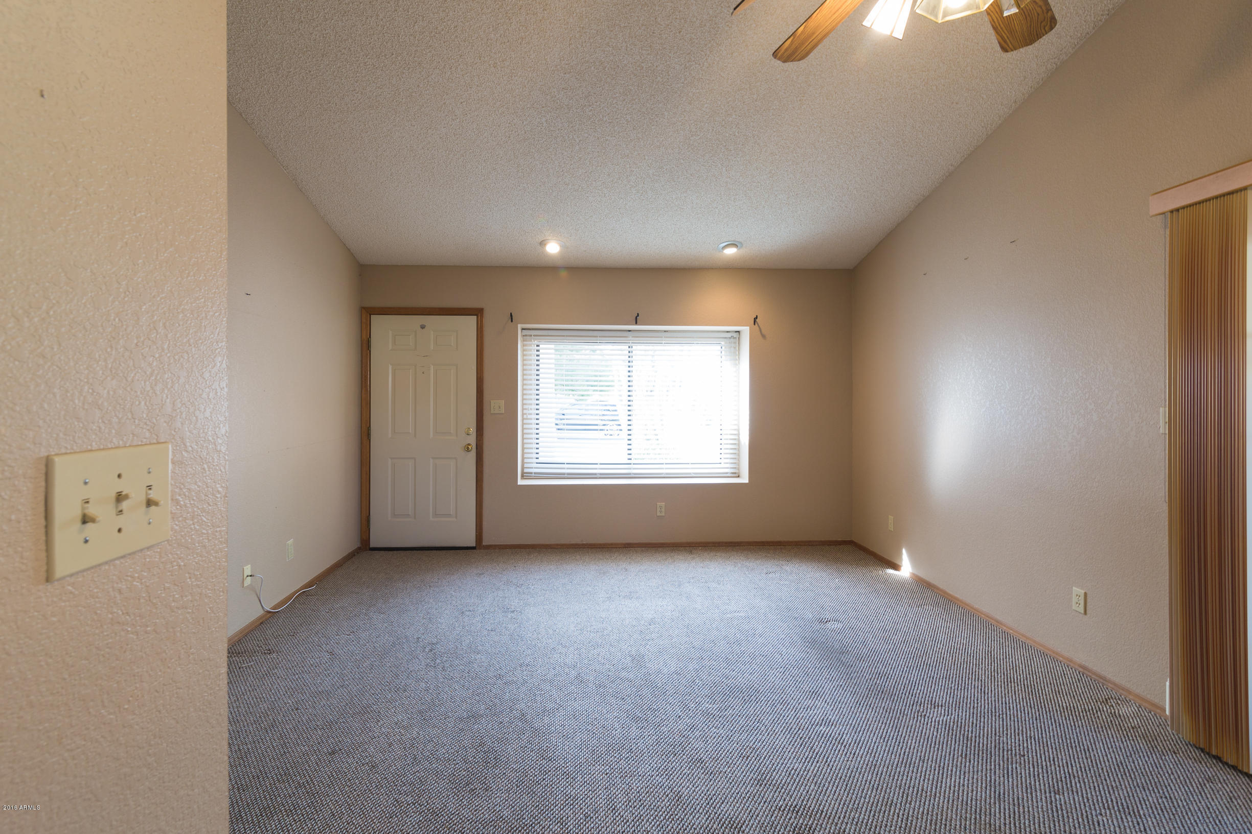 542 South Higley Road, Unit 78 Mesa, AZ 85206 - Photo 6 of 17 an empty room with a empty space and windows