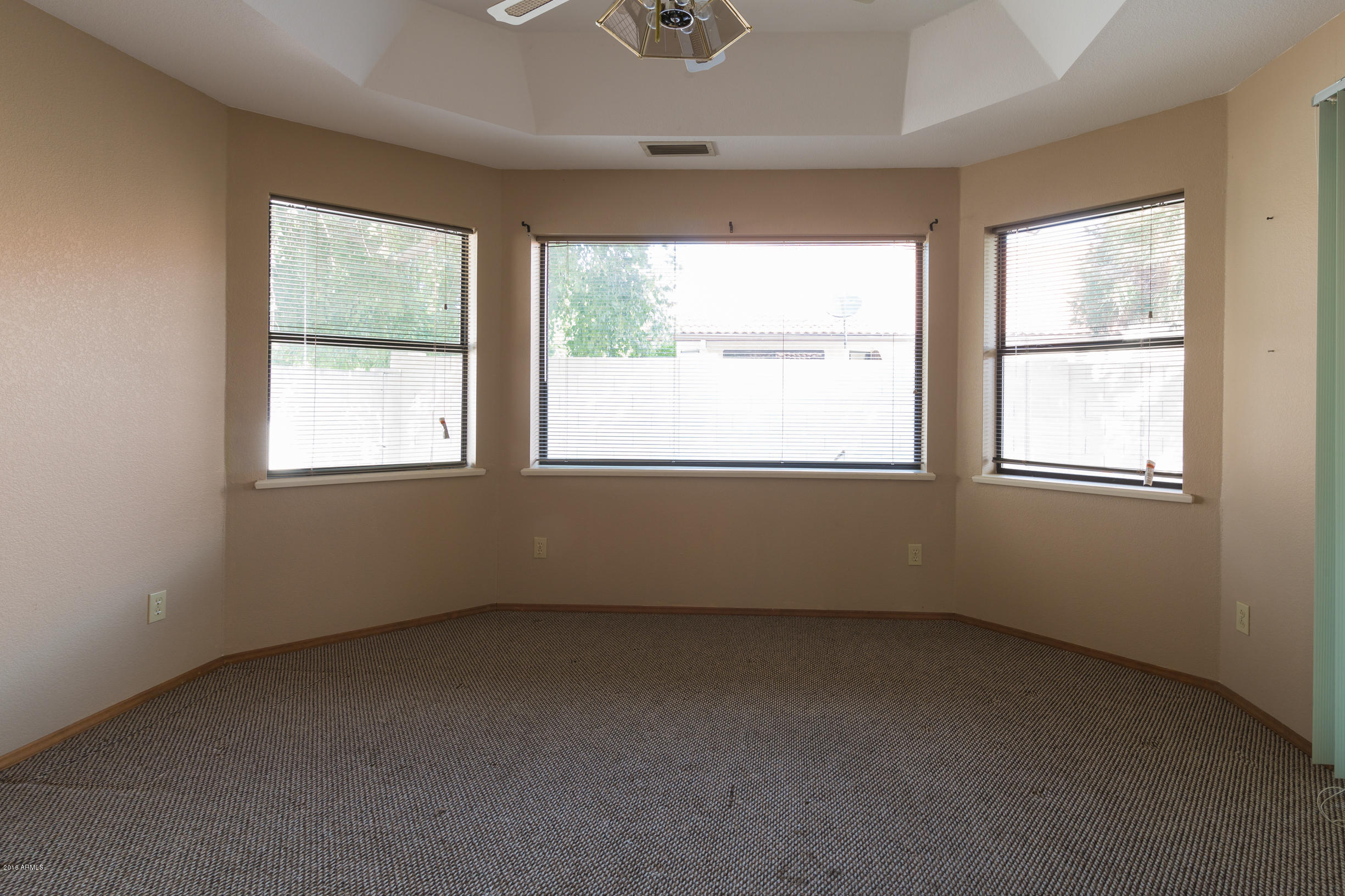 542 South Higley Road, Unit 78 Mesa, AZ 85206 - Photo 8 of 17 an empty room with a window