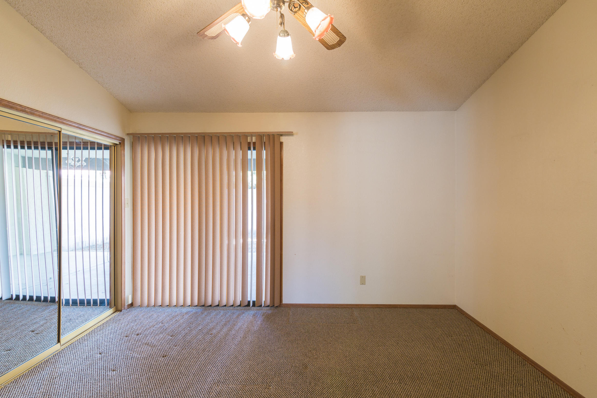 542 South Higley Road, Unit 78 Mesa, AZ 85206 - Photo 10 of 17 an empty room with windows