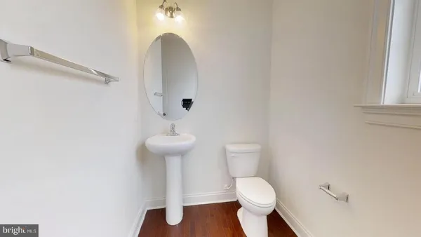 a view of an empty room with a fireplace