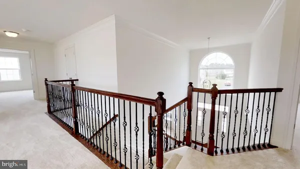 a view of a hallway with windows