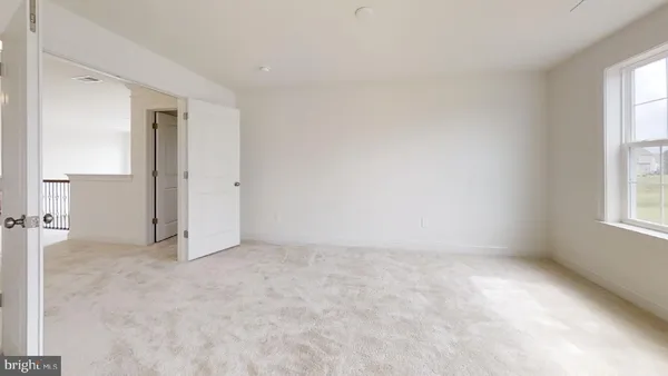 a spacious bathroom with a bathtub and window