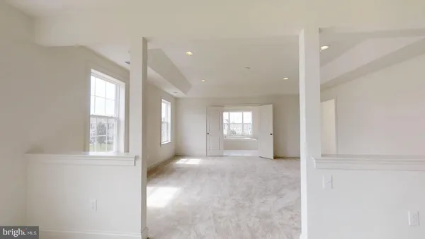 a bathroom with a tub and large window