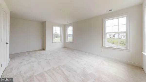 a white toilet sitting next to a bath tub