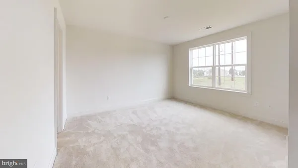 a view of a white house with a yard