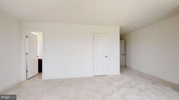 a bathroom with a toilet and a bathtub
