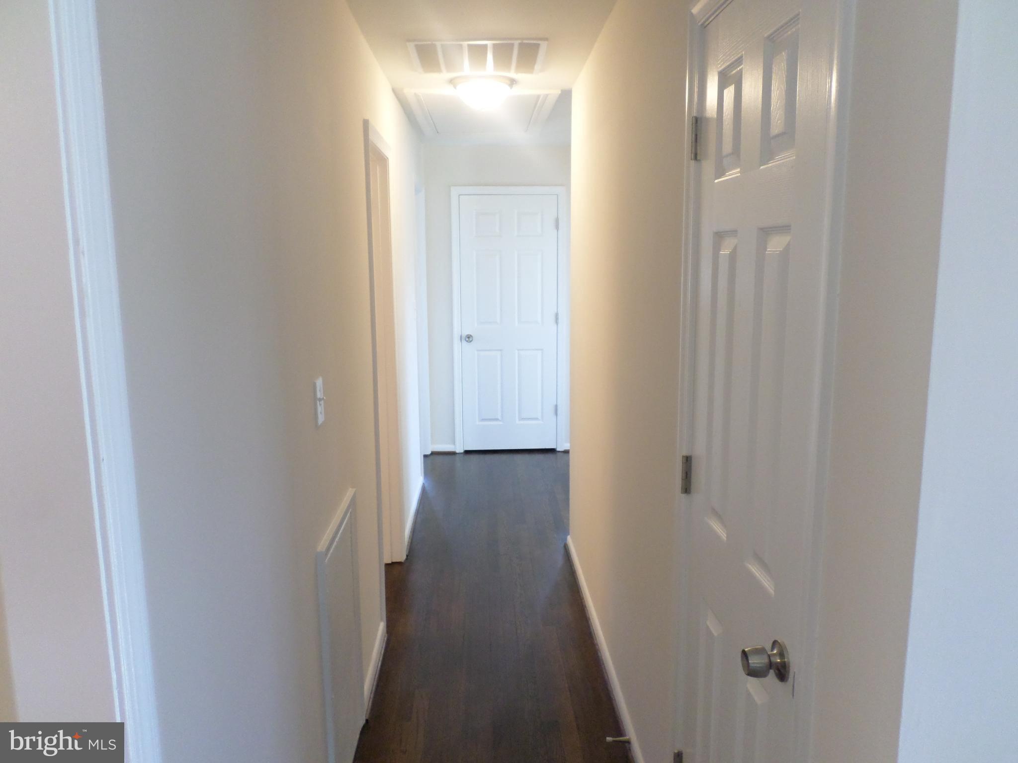 2976 Gracefield Road Silver Spring, MD 20904 - Photo 12 of 25 a view of a hallway with wooden floor