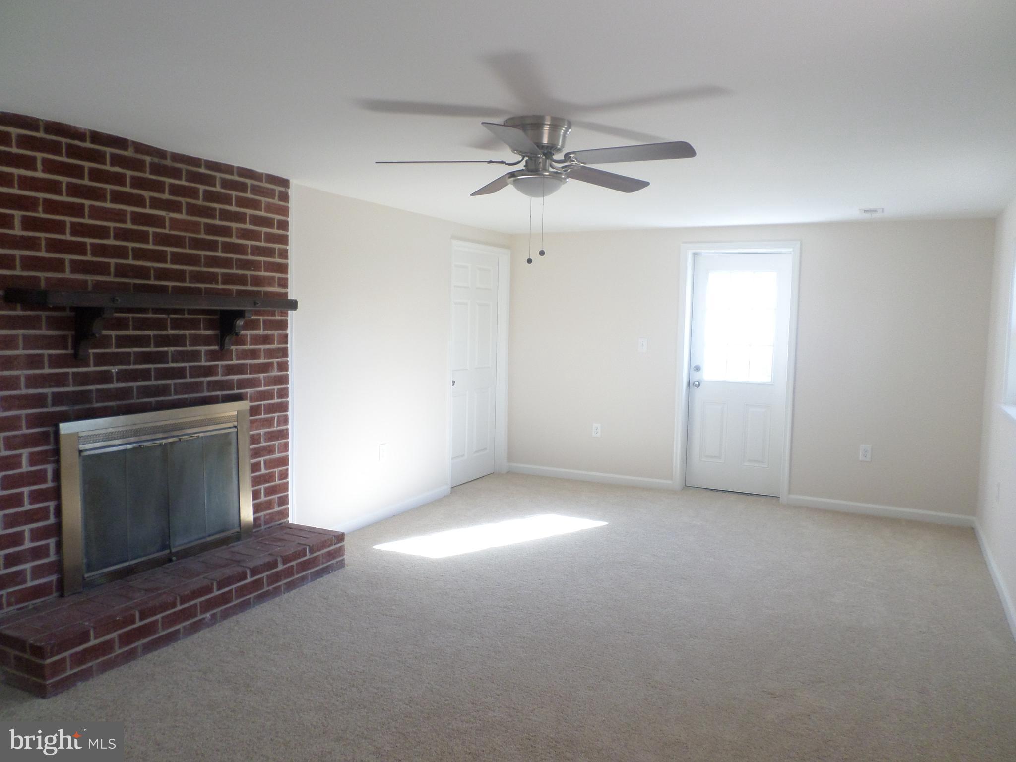 2976 Gracefield Road Silver Spring, MD 20904 - Photo 19 of 25 a view of an empty room with a fireplace