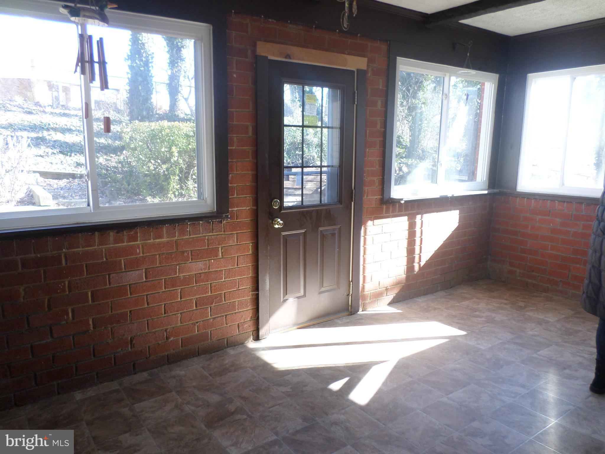 2976 Gracefield Road Silver Spring, MD 20904 - Photo 22 of 25 a view of entry way with wooden door