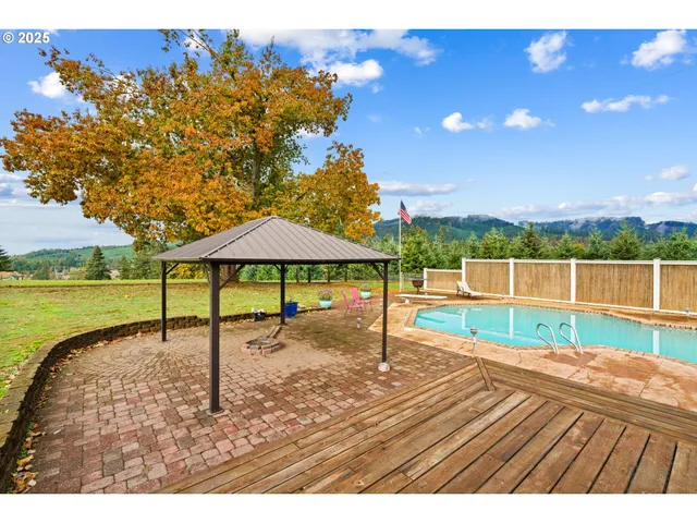 a view of a swimming pool with a lounge chairs