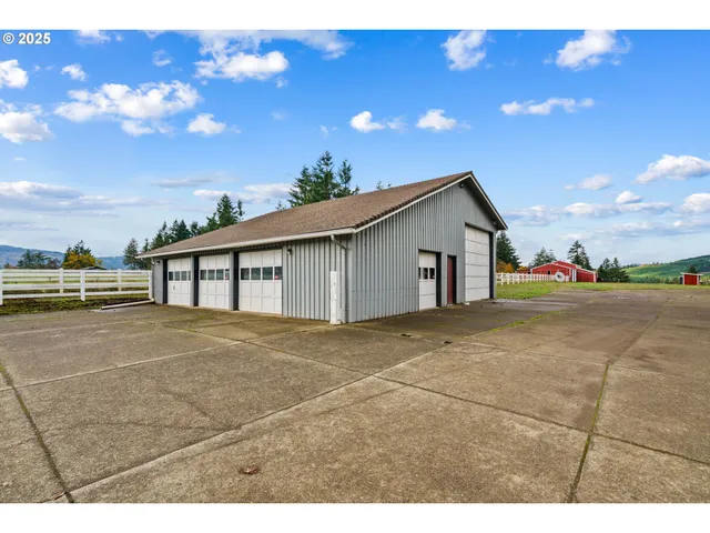 a view of a house with a backyard and a garage