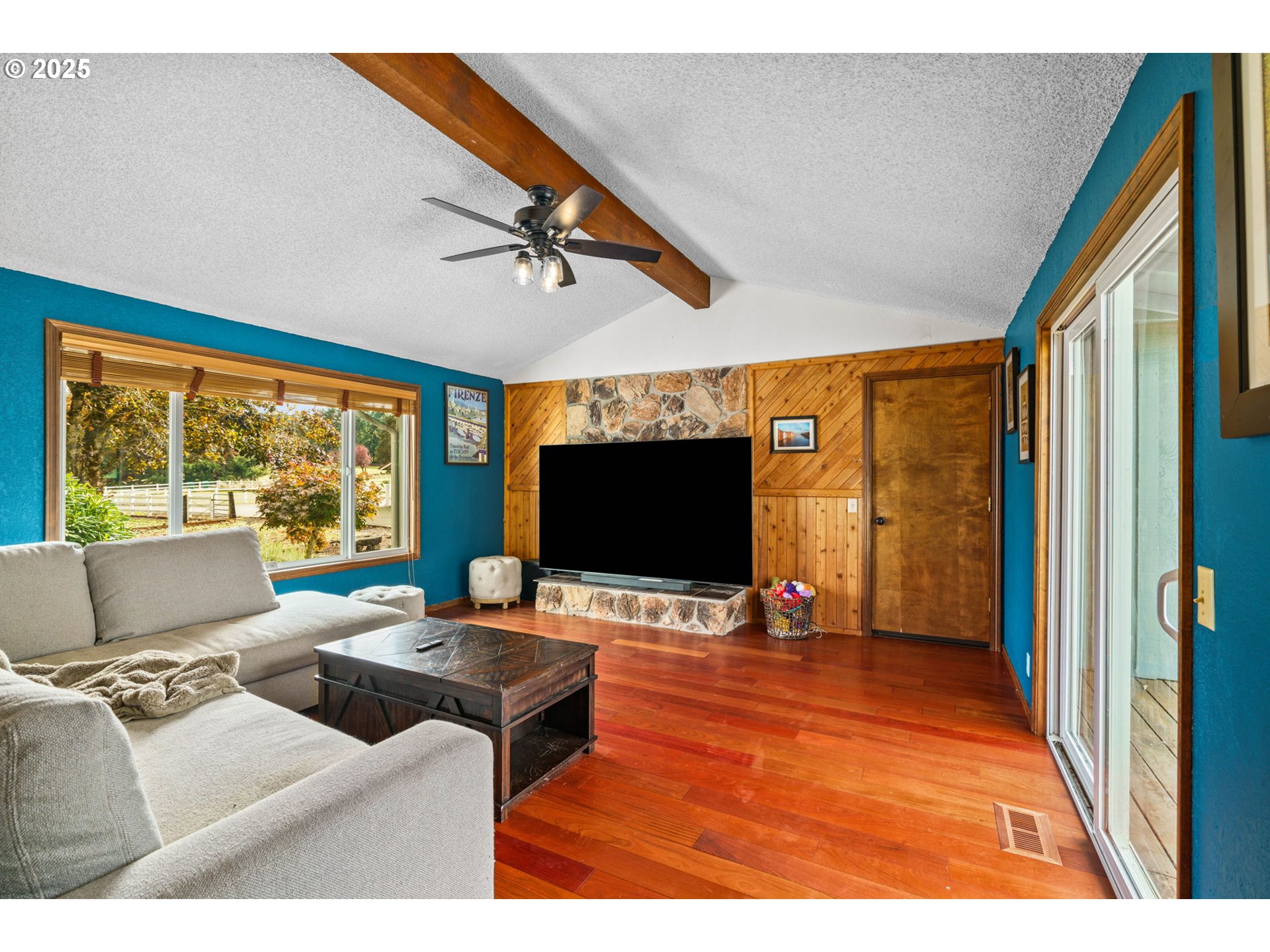 88692 Ermi Bee Road Springfield, OR 97478 - Photo 26 of 41 a living room with furniture and a flat screen tv