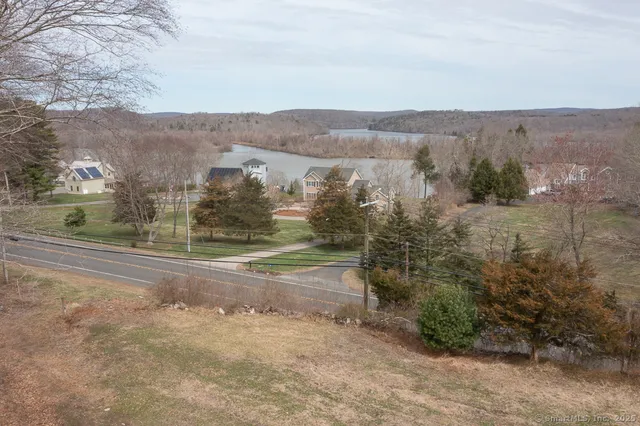 a view of a town with mountains in the background