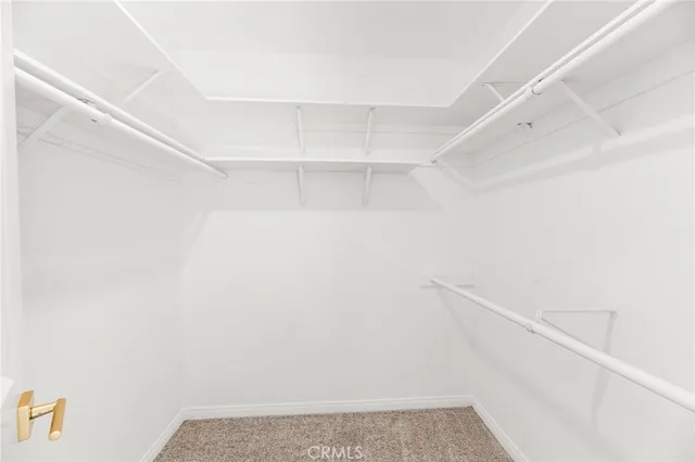 a view of a porch with furniture and a yard