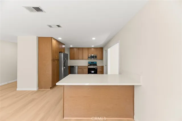 a view of kitchen with wooden floor