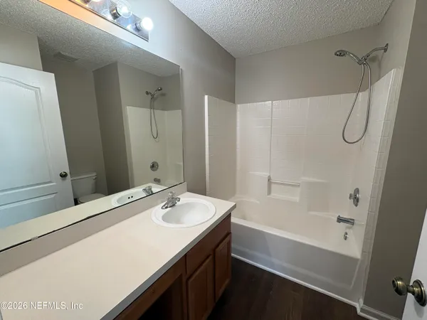 a bathroom with a bathtub and a sink