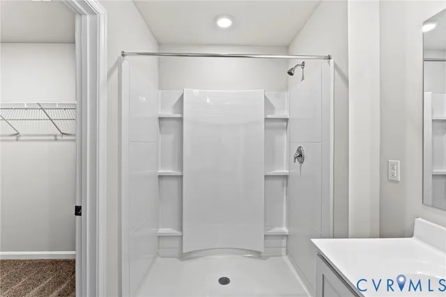 a bathroom with a shower and a bath tub