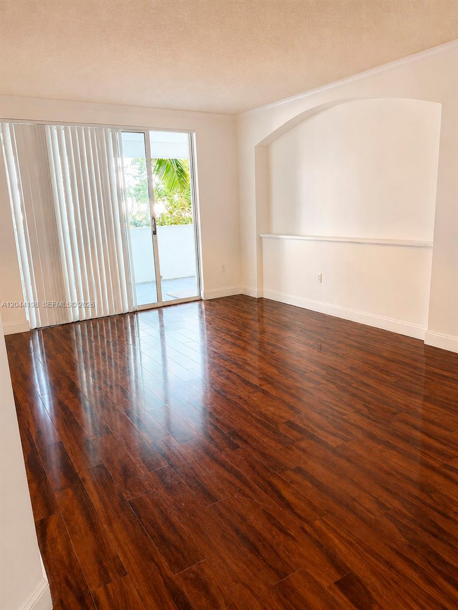 17145 North Bay Road, Unit 4307 Sunny Isles Beach, FL 33160 - Photo 21 of 35 wooden floor in an empty room with a window