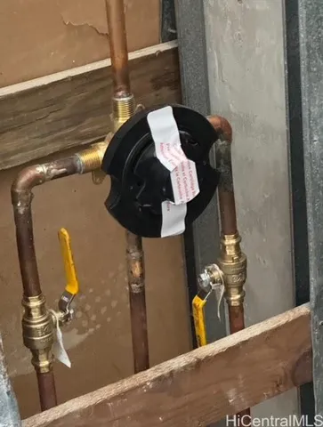 a bathroom with a granite countertop sink and a window
