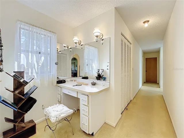 a bathroom with a sink a toilet a mirror and shower