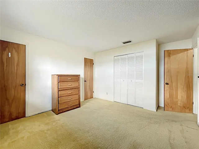 a view of a garden with a building in the background