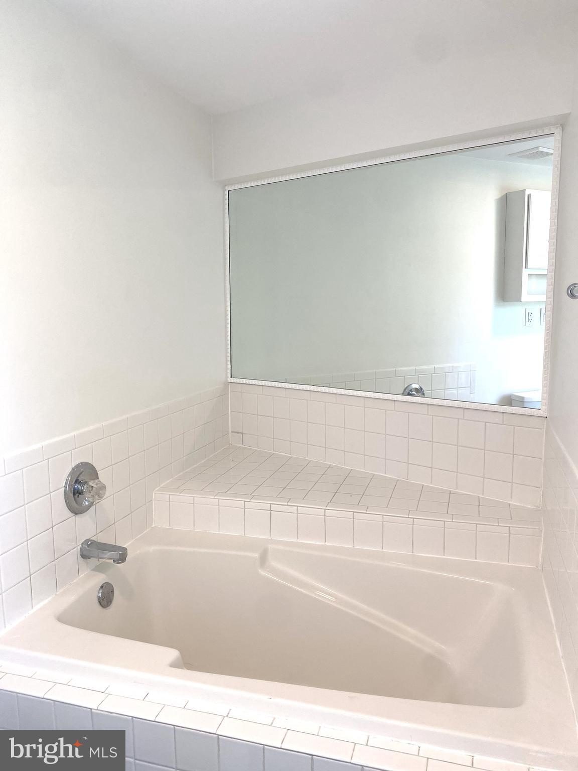 3436 Littleleaf Place Laurel, MD 20724 - Photo 11 of 18 a bathroom with a bathtub