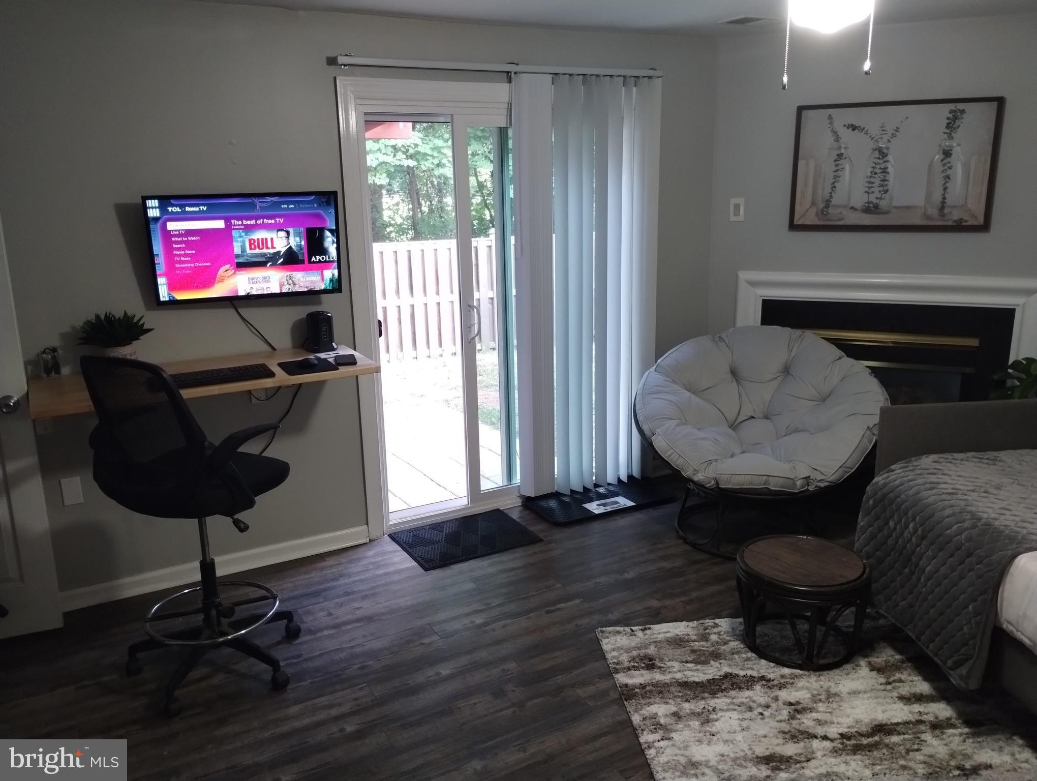 3436 Littleleaf Place Laurel, MD 20724 - Photo 15 of 18 a living room with furniture and a flat screen tv