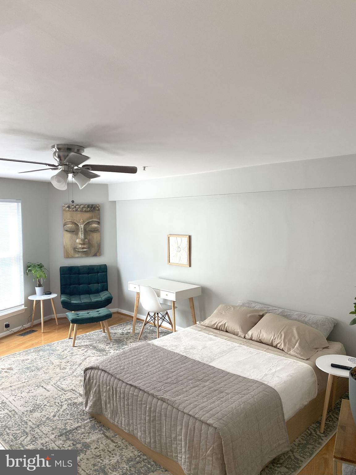 3436 Littleleaf Place Laurel, MD 20724 - Photo 8 of 18 a bedroom with a bed and a chandelier