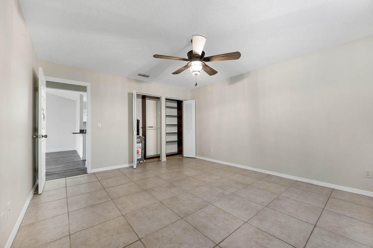 9015 Southeast Hobe Ridge Avenue Hobe Sound, FL 33455 - Photo 14 of 18 Master Bedroom