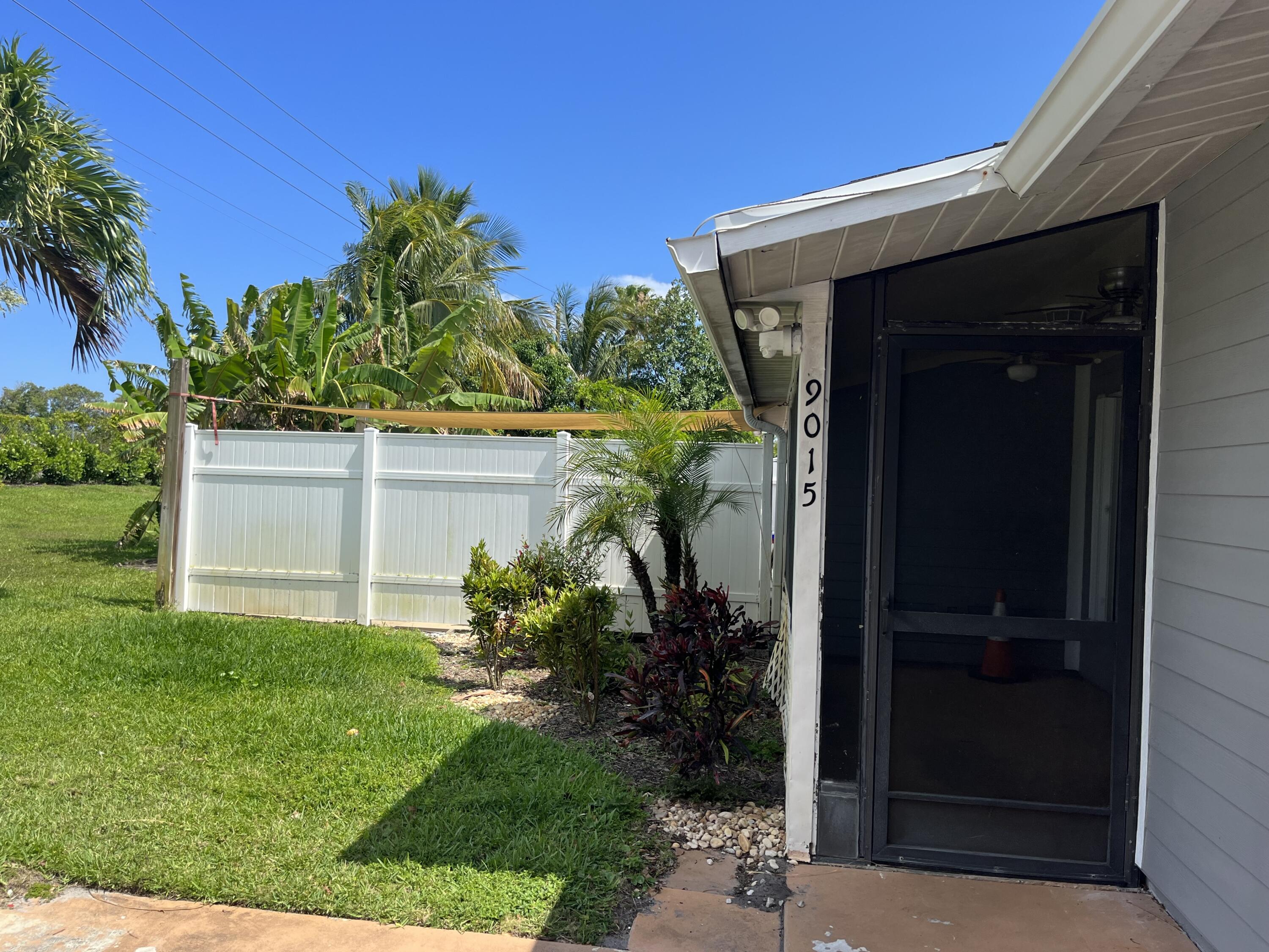 9015 Southeast Hobe Ridge Avenue Hobe Sound, FL 33455 - Photo 2 of 18 Patio Entrance
