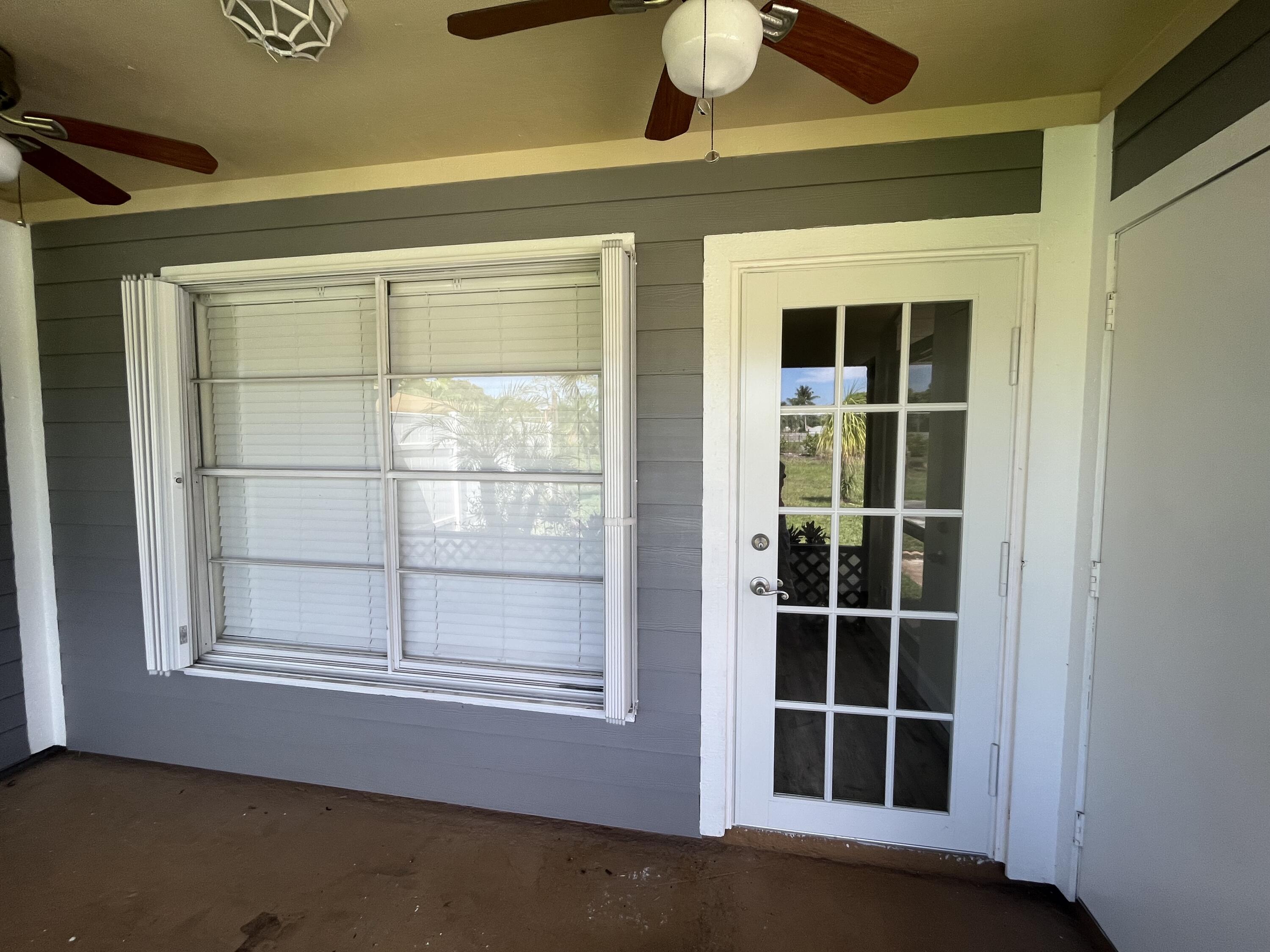 9015 Southeast Hobe Ridge Avenue Hobe Sound, FL 33455 - Photo 3 of 18 Front Door Entrance