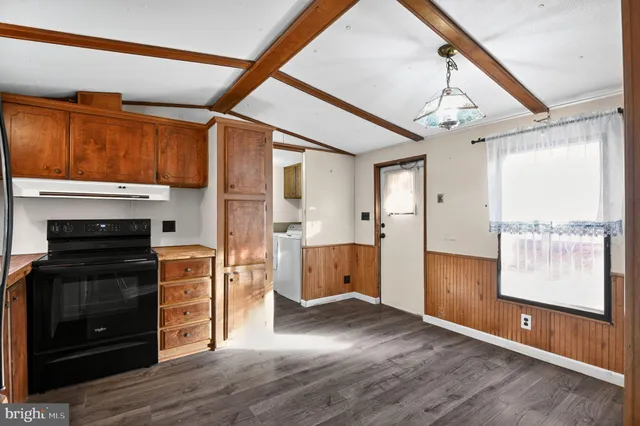 a view of a kitchen with a sink and a window