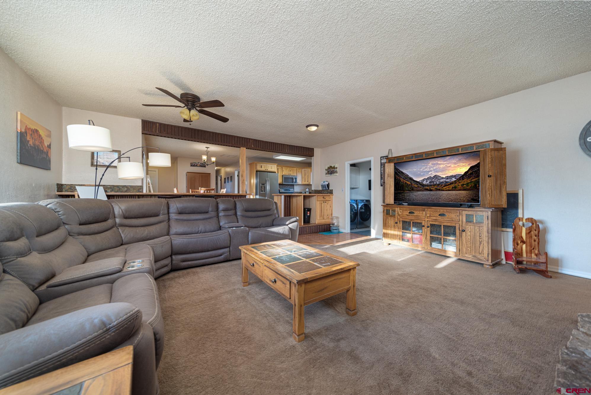 11500 6250th Road Montrose, CO 81401 - Photo 13 of 35 a living room with furniture and a flat screen tv