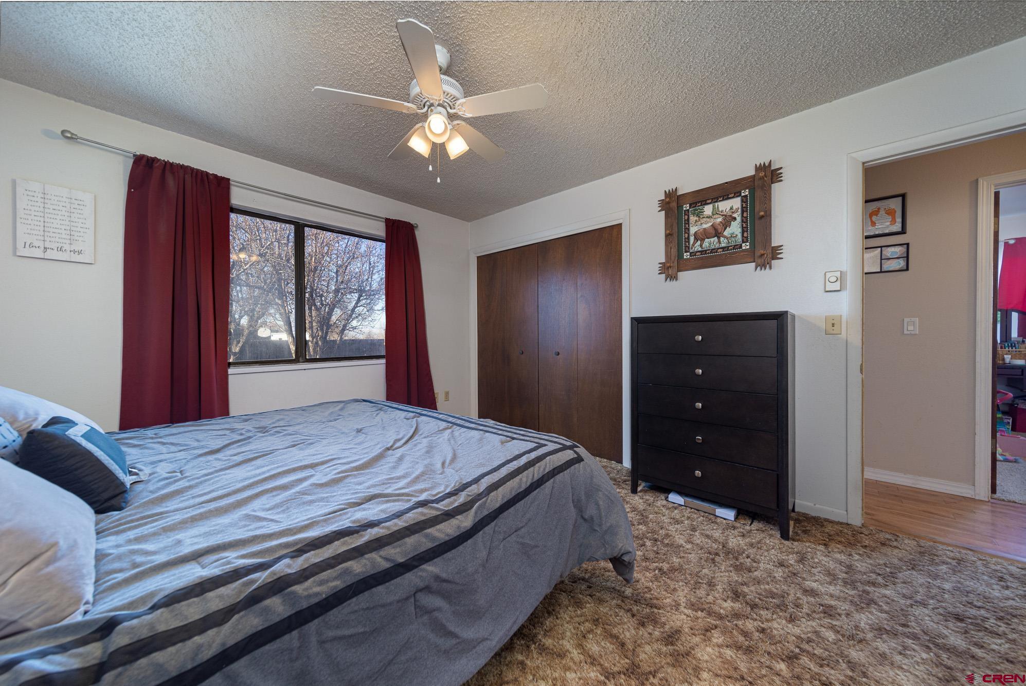 11500 6250th Road Montrose, CO 81401 - Photo 14 of 35 a bedroom with a bed and a window