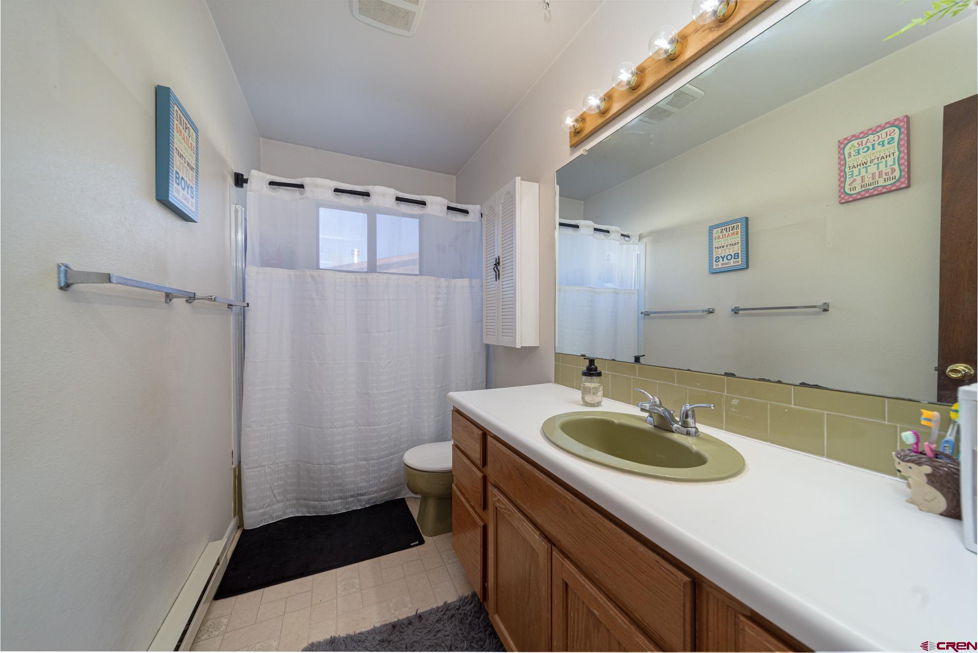11500 6250th Road Montrose, CO 81401 - Photo 17 of 35 a bathroom with a sink and a mirror