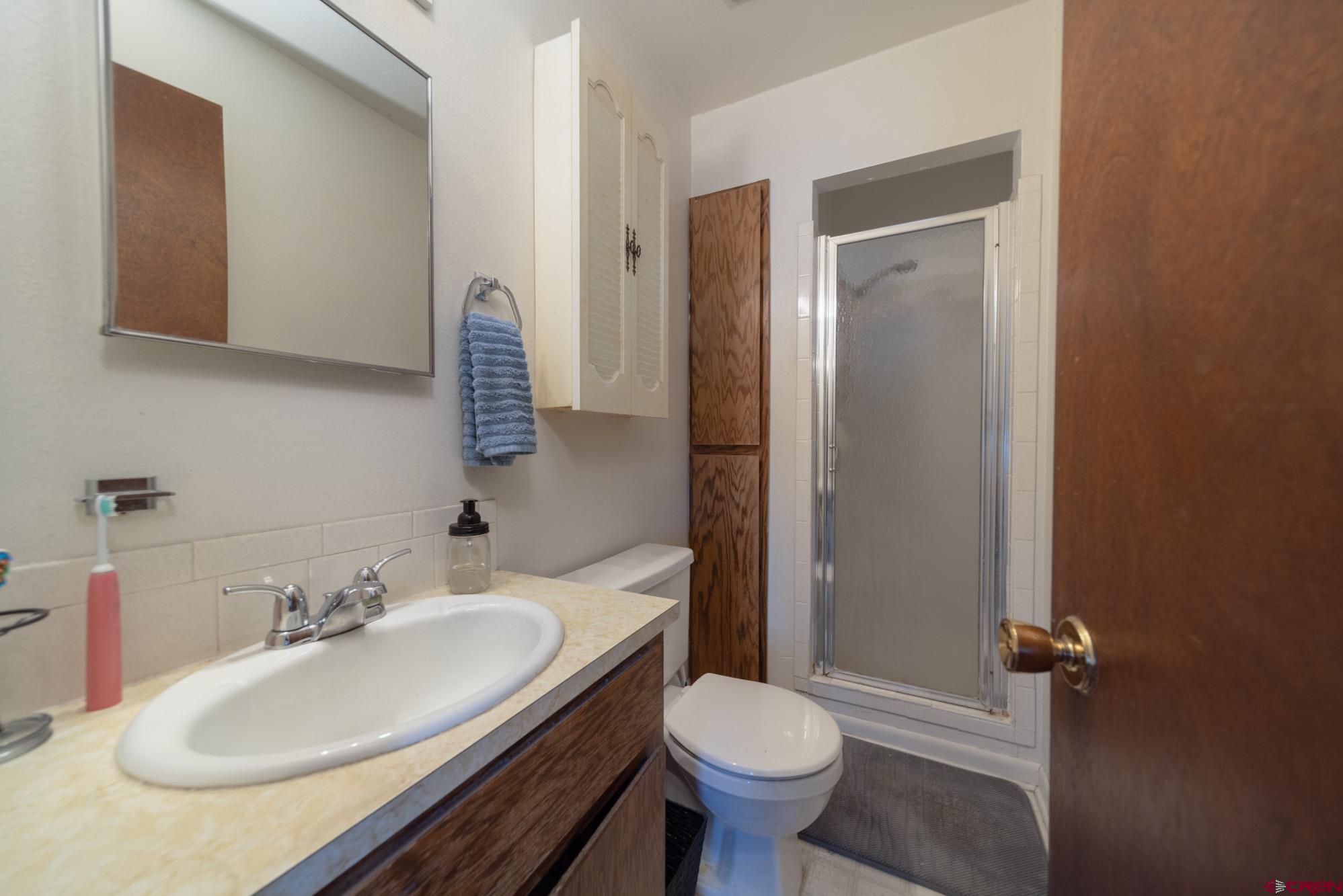 11500 6250th Road Montrose, CO 81401 - Photo 21 of 35 a bathroom with a sink toilet and shower