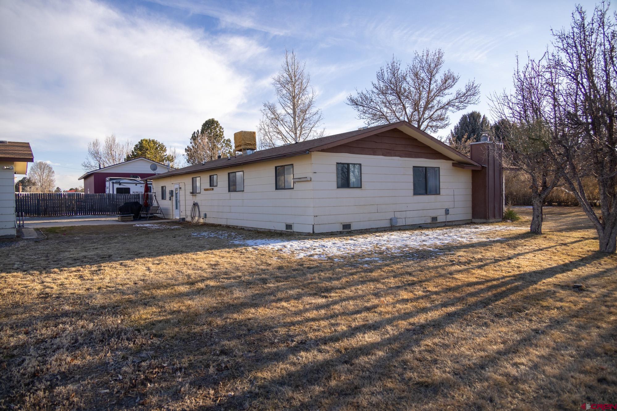 11500 6250th Road Montrose, CO 81401 - Photo 32 of 35 a view of a house with a yard