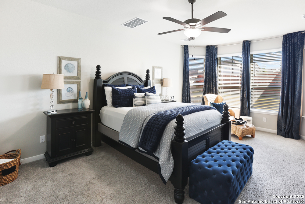 315 Canton Chase Cibolo, TX 78108 - Photo 24 of 36 a bedroom with a bed and a chandelier