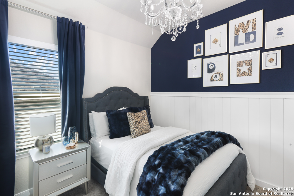 315 Canton Chase Cibolo, TX 78108 - Photo 26 of 36 a bedroom with a bed and a painting on the wall