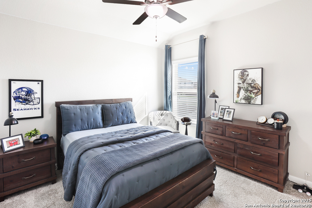 315 Canton Chase Cibolo, TX 78108 - Photo 34 of 36 a bedroom with a bed and a dresser