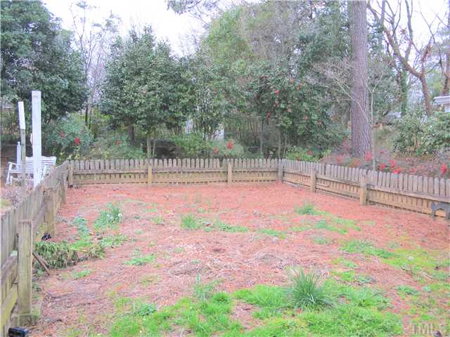 1814 Arlington Street Raleigh, NC 27608 - Photo 17 of 20 a view of a backyard with iron fence