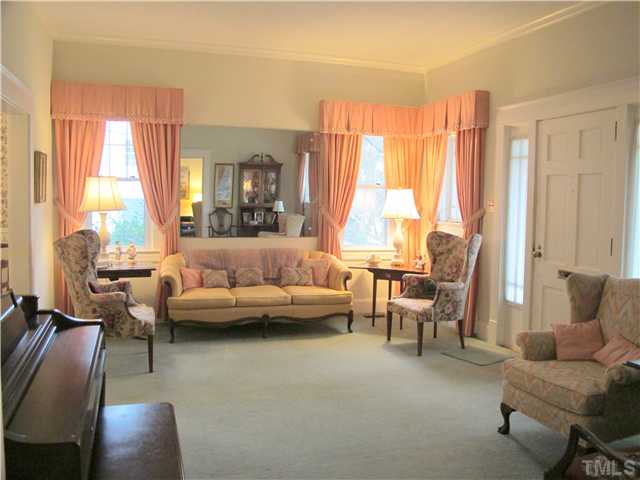 1814 Arlington Street Raleigh, NC 27608 - Photo 4 of 20 a living room with furniture and a large window