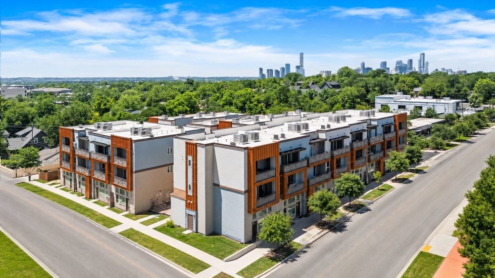 2827 Manor Road, Unit 2201 Austin, TX 78722 - Photo 2 of 40 Modern multi-story buildings featuring balconies, a flat roofline, and contemporary exterior finishes