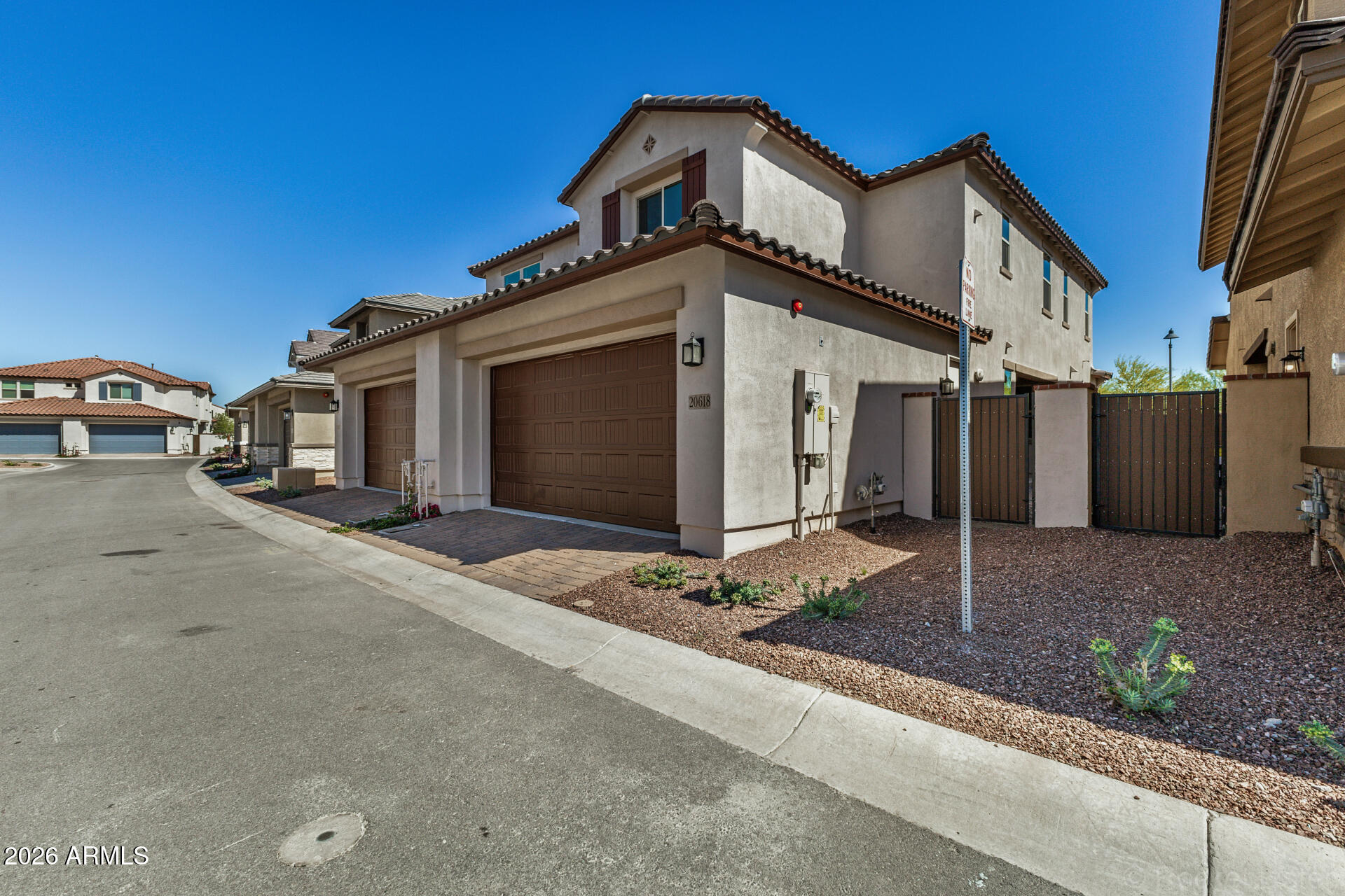 20618 West Thomas Road Buckeye, AZ 85396 - Photo 31 of 38 a front view of a house with a yard and garage