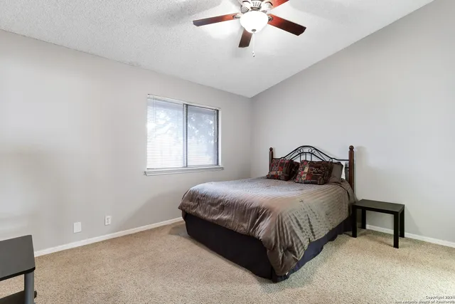 a bedroom with a bed and window