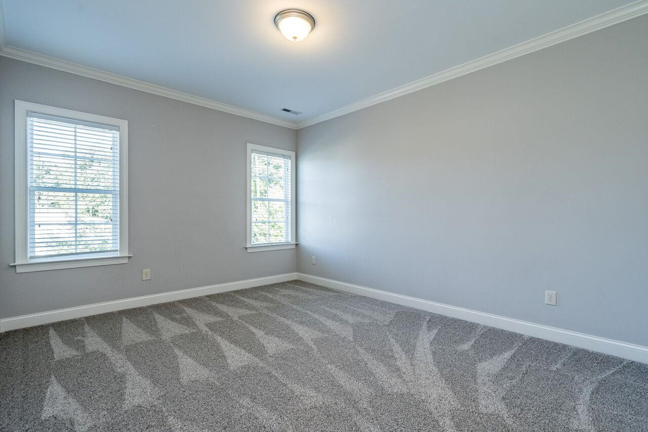 8035 Brandyapple Drive Raleigh, NC 27615 - Photo 24 of 30 Second floor bedroom with private access door to hall bath and new carpet. Bedroom