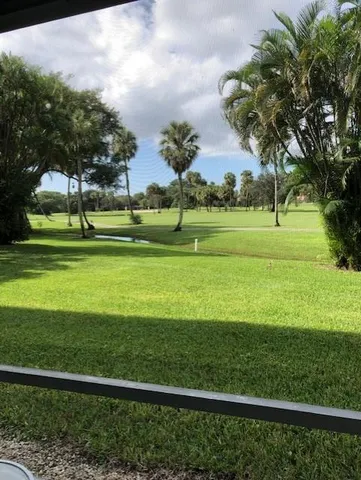 a view of a golf course with a lake