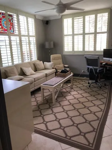 a living room with furniture and a window