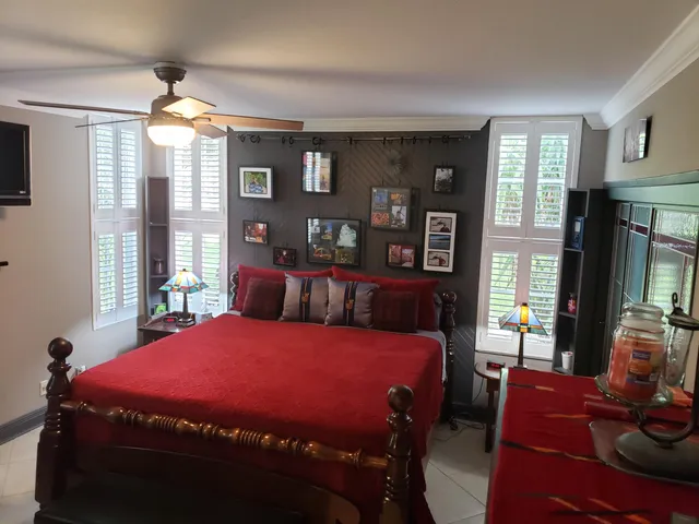 a bedroom with a bed and a night stand